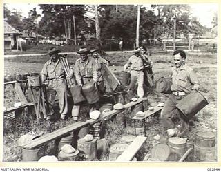 LAE, NEW GUINEA. 1944-11-12. A TYPICAL GROUP OF TROOPS ARRIVING TO WATCH THE SCREENING OF THE 1944 MELBOURNE CUP ARRANGED BY AUSTRALIAN ARMY AMENITIES SERVICE ATTACHED HQ FIRST ARMY