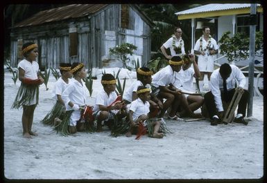 Group of unidentified child dancers, with drummers, at a welcoming ceremony during Sir Arthur Porritt's state visit to Palmerston Island