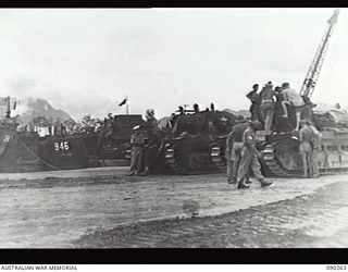 TOROKINA BEACHHEAD, BOUGAINVILLE, 1945-03-30. THE BEACHHEAD SCENE SHOWING B SQUADRON, 2/4TH ARMOURED REGIMENT MATILDA TANKS, AND A NUMBER OF AMERICAN LANDING CRAFT TRANSPORT IN THE BACKGROUND. THE ..