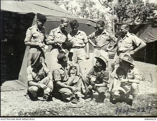 Fenton, NT. c. November 1945. An informal group portrait of the crew from a Consolidated B24 Liberator bomber aircraft of No. 24 Squadron RAAF in front of a tent. Flight Lieutenant (Flt Lt) Bob ..