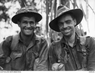 SATTELBERG AREA, NEW GUINEA. 1943-11-18. SX13578 PRIVATE A. T. MITCHELL OF PORT PIRIE, SA (LEFT), AND SX8086 PRIVATE F. G. GILBERT OF NAIRNE, SA (RIGHT), BOTH OF C COMPANY, 2/48TH AUSTRALIAN ..