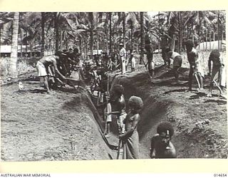 1943-04-14. NEW GUINEA. MOSQUITO CONTROL. FIVE HUNDRED ACRES OF WATER LOGGED GROUND WILL BE DRAINED BY THIS CHANNEL. FIFTY NATIVE BOYS WILL COMPLETE THE WORK IN SIX WEEKS. IN 1942-12, MALARIA ..