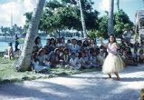 Native women and children watching a woman dance, Likiep Atoll, August 20, 1949