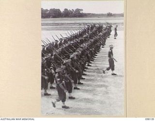TOROKINA, BOUGAINVILLE. 1945-10-22. A CEREMONIAL PARADE AND MARCH PAST BY 29 INFANTRY BRIGADE WAS HELD FOR MAJOR-GENERAL BRIDGEFORD, GENERAL OFFICER COMMANDING 3 DIVISION, AT TOROKINA AIRFIELD. ..