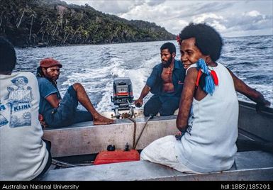 Dinghy to Mwatu Camp, Angelus and Daniel, field assistants, and two passengers