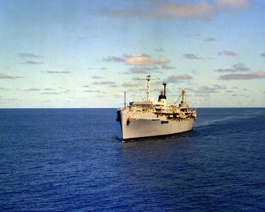 A port bow view of the submarine tender USS HUNLEY (AS-31) underway