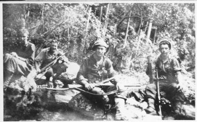 Jack Arden (centre) with three other members of the 2/3rd Australian Independent Company, [New Guinea, July, 1943]