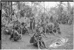 Returned laborers, purification ritual: women and children gather