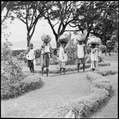 Five laden women in Chinnery's garden, Malaguna Road, Rabaul, New Guinea, ca. 1936, 2 / Sarah Chinnery