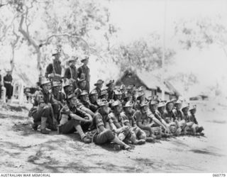 POM POM VALLEY, NEW GUINEA. 1943-11-27. A GROUP OF THE 2/10TH AUSTRALIAN INFANTRY BATTALION, THE CHAMPION GUARD OF THE 18TH AUSTRALIAN INFANTRY BRIGADE. THEY ARE: NX150251 CORPORAL P. G. REARDON ..