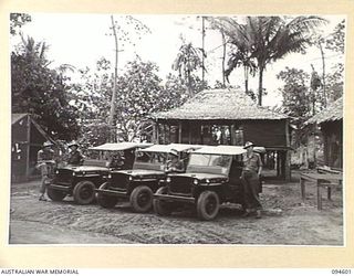 NANTAMBU, NEW BRITAIN, 1945-07-26. JEEPS AND BUILDINGS AT BATTALION HEADQUARTERS, NANTAMBU