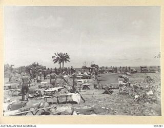 BUIN AREA, BOUGAINVILLE. 1945-09-13. MEMBERS OF THE AUSTRALIAN SURRENDER PARTY FROM HEADQUARTERS 2 CORPS PREPARING A CAMP ON KAHILI BEACH. THE CAMP IS FOR USE DURING GROUP CONFERENCES WITH THE ..