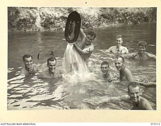 REMPI, NEW GUINEA. 1944-05-09. MEMBERS OF "A" COMPANY, 35TH INFANTRY BATTALION, WASHING IN A STREAM NEAR REMPI AFTER WALKING FROM ALEXISHAFEN. IDENTIFIED PERSONNEL ARE:- NX120658 PRIVATE L.J. ..