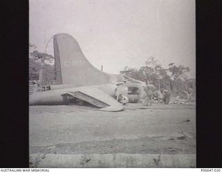 MILNE BAY, PAPUA, 1943-01-19. REMAINS OF BOEING B17 AIRCRAFT ON NO. 3 STRIP (TURNBULL FIELD) AFTER JAPANESE AIR RAID. (DONOR - T.G. JONES)