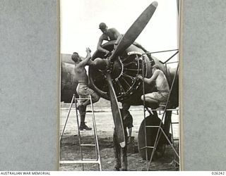 NEW GUINEA, 1942-08-10. AN ENGINE OVERHAUL BY AMERICAN MECHANICS TO A HEAVY UNITED STATES BOMBER BEFORE SETTING OUT FOR RABAUL