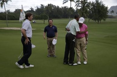 Barack Obama plays golf with Prime Minister Najib Razak, Joe Paulsen, and Mike Brush in Kaneohe Bay, Hawaii, December 24, 2014