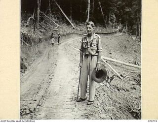 WAMPIT, NEW GUINEA, 1944-03-02. QX34507 LIEUTENANT COLONEL W.J. REINHOLD, OBE, MC, HEADQUARTERS COMMANDER, ROYAL ENGINEERS (A.I.F.), MAKING AN INSPECTION 67 MILES FROM WAU ON THE WAU - LAE ROAD ..