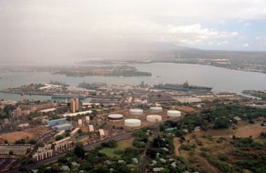 OS2 John Bouvia Naval Station, Pearl Harbor, Hawaii....An aerial view of the naval station and surrounding community, with U.S. Navy ships in port. OFFICIAL U.S. NAVY PHOTO (RELEASED)