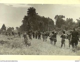 BABIANG, NEW GUINEA. 1944-11-08. THE PATROL FROM A TROOP, AUSTRALIAN NEW GUINEA ADMINISTRATIVE UNIT ATTACHED 2/10 COMMANDO SQUADRON TRAVELLING TOWARDS SUAIN