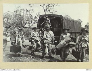 LAE, NEW GUINEA, 1945-05-07. AUSTRALIAN WOMEN'S ARMY SERVICE PERSONNEL ARRIVING AT THE AUSTRALIAN WOMEN'S ARMY SERVICE BARRACKS ON BUTIBUM ROAD. THEY ARE PART OF A GROUP OF 342 AUSTRALIAN WOMEN'S ..