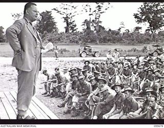 LAE, NEW GUINEA, 1946-01-28. THE HONOURABLE F. M. FORDE, MINISTER FOR THE ARMY, WHO IS ON AN INSPECTION TOUR OF AUSTRALIAN UNITS IN THE LAE AREA, ADDRESSING TROOPS AT THE OTHER RANKS' CLUB. AFTER ..