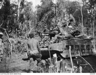 SOUTH BOUGAINVILLE. 1945-07-24. MATILDA TANKS OF 4 TROOP, A SQUADRON, 2/4 ARMOURED REGIMENT, CROSSING A CULVERT ON BUIN ROAD EAST OF THE MOBIAI RIVER. THEY ARE MOVING FORWARD TO RELIEVE 2 TROOP, ..