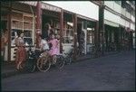 Papeete, Tahiti: street scene, girls on bicycles