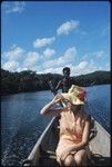 Anne Scheffler with Solomon islander on a canoe