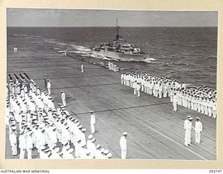 AT SEA OFF RABAUL, NEW BRITAIN. 1945-09-06. SAILORS FORMING ON THE FLIGHT DECK ABOARD THE AIRCRAFT CARRIER HMS GLORY BEFORE THE ARRIVAL OF GENERAL H. IMAMURA, COMMANDER EIGHTH AREA ARMY, TO SIGN ..
