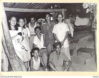 RABAUL AREA, NEW BRITAIN. 1945-09-13. CHINESE CIVILIANS, INTERNED BY THE JAPANESE AT A CAMP 15 MILES WEST OF RABAUL, WERE CONTACTED BY A PARTY OF AUSTRALIAN ARMY AND RED CROSS OFFICIALS SOON AFTER ..