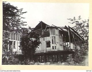THE REMAINS OF THE RABAUL HOSPITAL WHICH IS NOW USED AS THE OFFICERS MESS, 11 DIVISION SIGNALS