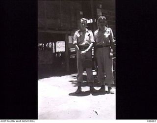 TERAPO, NEW GUINEA. 1943-09-16. VX16438 LIEUTENANT R. L. KIDBY (LEFT) AND SERGEANT R. HAYMAN, AUSTRALIAN MOVEMENT CONTROL REPRESENTATIVES