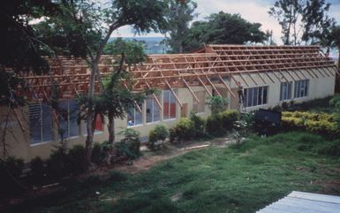 A view of repair efforts being made on the public school by members of Naval Mobile Construction Battalion 62. Seabees are helping to rapair damage caused by Cyclone Uma