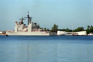 Crew members man the rails aboard the guided missile cruiser USS CHOSIN (CG-65) as the vessel moves past the USS ARIZONA MEMORIAL. The CHOSIN is taking part in an observance commemorating the 50th anniversary of the Japanese attack on Pearl Harbor