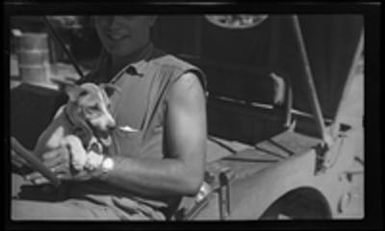 [Elmer A. Ball and Foo Foo the Dog in jeep]