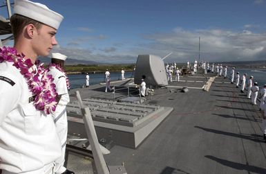 U.S. Navy Sailors aboard the Arleigh Burke Class Guided Missile Destroyer USS HOPPER (DDG 70) man the rails as they enter their homeport at Pearl Harbor, Hawaii on Sep. 15, 2006 after a scheduled deployment .U.S. Navy photo by Mass Communication SPECIALIST Second Class John L. Beeman (Released)