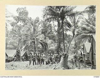 JACQUINOT BAY, NEW BRITAIN. 1944-11-10. TENT LINES OF NO. 19 PLATOON, 2/1ST GUARD REGIMENT ATTACHED TO HEADQUARTERS, 5TH DIVISION, IN THE JUNGLE NEAR THE MALMAL MISSION. IDENTIFIED PERSONNEL ARE: ..