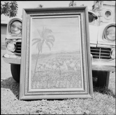 Painting leaned against the front of a car, Taveuni, Fiji, 1966 / Michael Terry