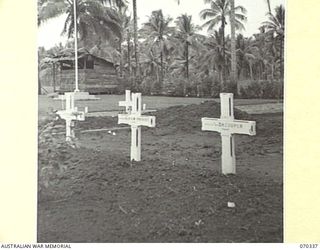 MILNE BAY, NEW GUINEA, 1944-02--09. THE GRAVES OF V508553 SAPPER KENNETH ARTHUR WRIGHT PROVOST, WHO DIED ON 1943-10-12, AND 408253 FLIGHT SERGEANT DONALD KEVAN COOPER OF NO. 100 SQUADRON RAAF WHO ..