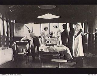 MILNE BAY, PAPUA. C.1942-12. INTERIOR OF ONE OF THE OPERATING THEATRES, WITH MEDICAL STAFF PERFORMING AN OPERATION, AT 110 AUSTRALIAN CASUALTY CLEARING STATION NEAR HAGITA FORD. (DONOR 4TH MILITARY ..