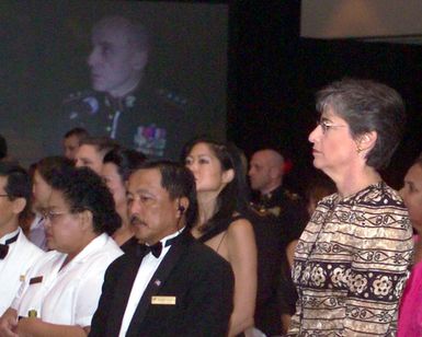 The Honorable Linda Lingle, right, Governor of Hawaii, listens to speakers at the USMC Officer Ball, celebrating the 228th anniversary of the founding of the Marine Corps