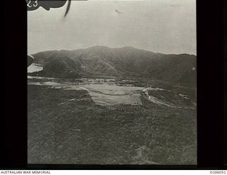 SALAMAUA, NEW GUINEA. C. 1943. AERIAL VIEW OF SALAMAUA AERODROME LOOKING EAST