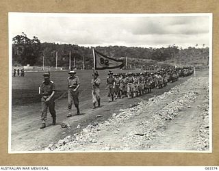 DONADABU, PAPUA, NEW GUINEA. 1944-01-01. THE GRAND MARCH BY THE 57/60TH INFANTRY BATTALION LED BY THE COMMANDING OFFICER OF THE UNIT IN PROGRESS AT THE START OF THE 15TH INFANTRY BRIGADE GYMKHANA. ..