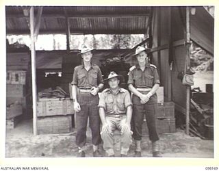 TOROKINA, BOUGAINVILLE. 1945-10-19. THE STAFF OF THE ASSISTANT DIRECTOR ORDNANCE SERVICE DUMP, 3 DIVISION. IDENTIFIED PERSONNEL ARE:- WARRANT OFFICER 1 T.W. STEVENS (1); MAJOR H.C. KELLY (2); ..