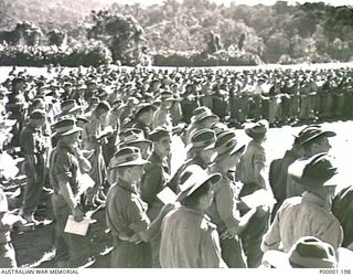 THE SOLOMON ISLANDS, 1945-08. AUSTRALIAN SOLDIERS STANDING DURING A THANKSGIVING SERVICE ON BOUGAINVILLE ISLAND. (RNZAF OFFICIAL PHOTOGRAPH.)