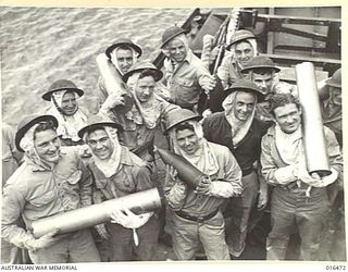 20 January 1944. GUN CREWS OF AN AUSTRALIAN BUILT DESTROYER AT ACTION STATIONS AFTER THE WARSHIP HAD WITHDRAWN FROM THE CAPE GLOUCESTER AREA, WHERE IT HAD PERFORMED VALUABLE SERVICE IN SOFTENING UP ..