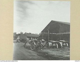 2 POUNDER ANTI-TANK GUNS AND 4.5 INCH HOWITZERS PARKED OUTSIDE THE WORKSHOP OF THE 43RD FIELD ORDNANCE DEPOT
