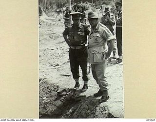 BOUGAINVILLE, SOLOMON ISLANDS. 1945-03-26. VX1 GENERAL SIR THOMAS BLAMEY, GBE, KCB, CMG, DSO, ED, COMMANDER- IN- CHIEF, ALLIED LAND FORCES, SOUTH WEST PACIFIC AREA (2), IN DISCUSSION WITH TX2002 ..