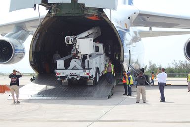 Bucket trucks being offloaded in Saipan, CNMI after being moved from Missouri, to Washington state, to Saipan. Back in August, Typhoon Soudelor caused major damage in Saipan and the local government asked for these trucks to help with the ongoing effort to restore long term power to the island. This truck is one of six that were delivered.