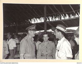 LAE AREA, NEW GUINEA, 1945-06-28. HIS ROYAL HIGHNESS, THE DUKE OF GLOUCESTER, GOVERNOR-GENERAL OF AUSTRALIA (1) WITH MISS J. HART, SUPERINTENDENT OF THE AUSTRALIAN RED CROSS SOCIETY (2) AND PTE J. ..
